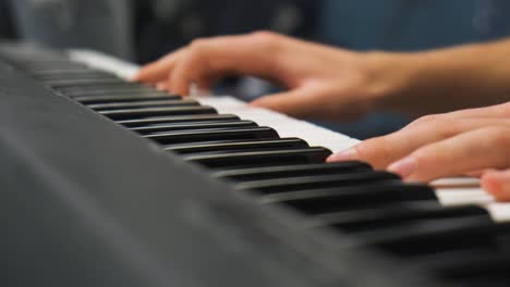 Fingers-dance-on-keys-of-black-and-white,-cascade-of-notes,-river-of-sound