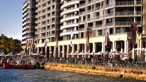 Handheld-footage-of-people-walking-between-Circular-Quay-and-the-Sydney-Opera-House