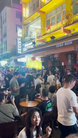 looking-very-high-crowd-on-street-beer-bar-in-the-night