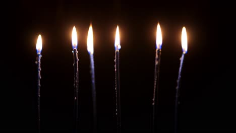 Immerse-yourself-in-tranquility-with-this-captivating-video-of-flickering-candle-lights-against-a-deep,-dark-background