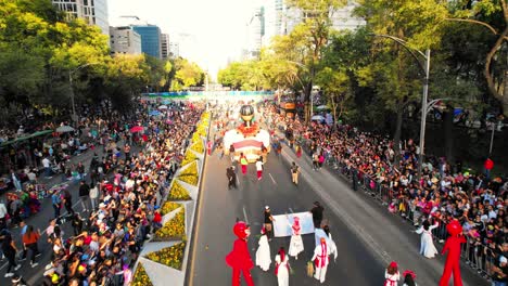 Drone-shot-of-grand-Day-of-the-Dead-Parade-in-Mexico-city