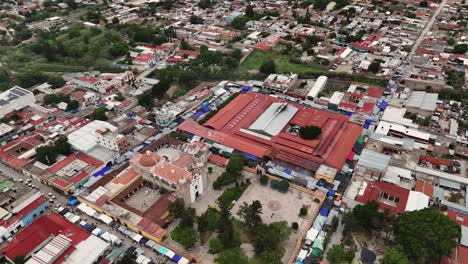 Aerial-view-of-church-and-market-of-Tlacolula-in-Central-Valleys-of-Oaxaca,-Mexico