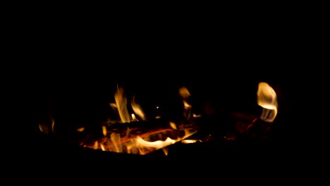 Small-Glowing-Fire-in-Camping-Firepit---Burning-Logs