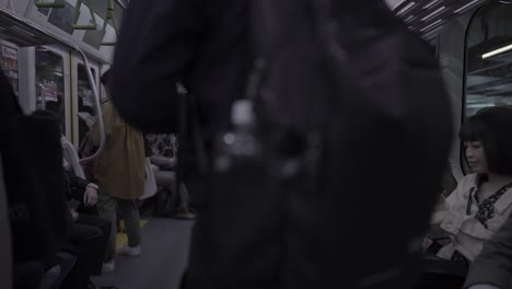 Slow-motion-of-Japanese-People-Commuters,-and-tourists-Traveling-with-Train-in-Tokyo,-Japan