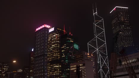 Hong-Kong-City-By-Night,-Lights-and-Illuminated-Modern-Buildings-in-Downtown