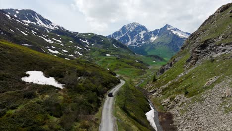 Car-driving-along-scenic-mountain-road-on-Mont-Cenis-or-Moncenisio,-France