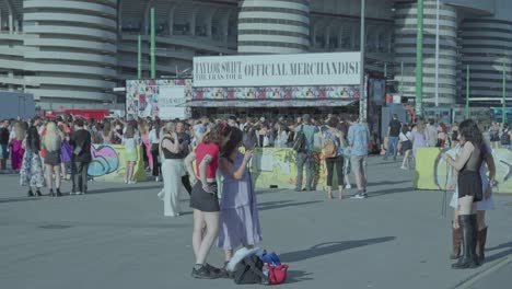 Friendship-memories-captured-on-smartphones,-San-Siro-Stadium-venue