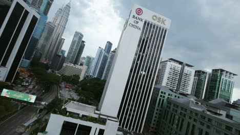 FPV-drone-shot-approaching-the-Bank-of-China-tower-in-Kuala-Lumpur,-Malaysia