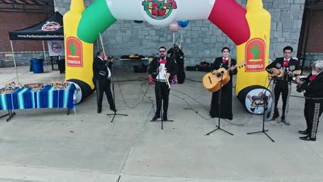 A-Local-Band-Enhances-the-Entertainment-at-the-Tacos-and-Tequila-5K-Race-in-Suwanee,-Georgia,-USA---Medium-Shot