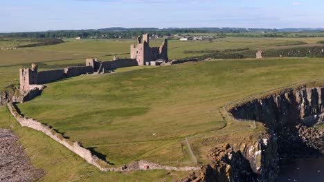 Aerial-footage-of-Dunstanburgh-Castle-and-the-surrounding-landscape