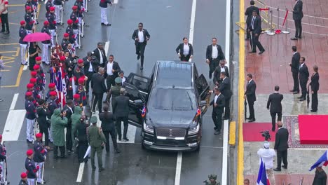 Arrival-of-President-Luis-Abinader-and-his-wife-at-the-Altar-of-the-Fatherland-on-Independence-Day,-disembarking-from-the-vehicle-in-an-aerial-shot-capturing-the-solemn-moment