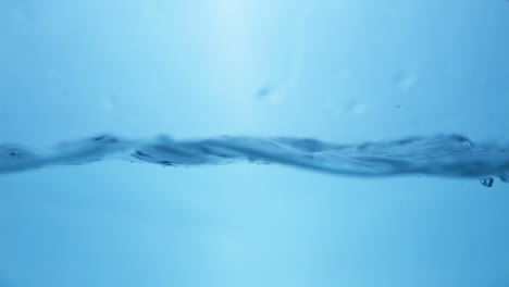 Water-waves-on-surface-with-blue-background