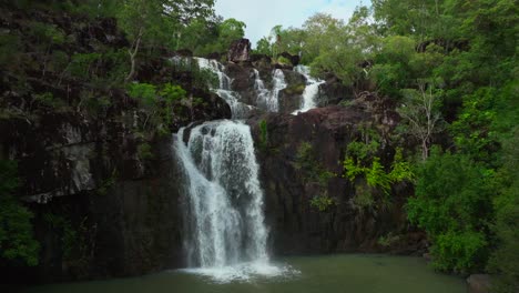 Cedar-Creek-Falls-Waterfalls-aerial-drone-Australia-Whitsundays-Airlie-Beach-Proserpine-Palm-Grove-QLD-Queensland-Rainy-wet-season-spring-summer-autumn-winter-sunny-cloudy-backwards-pan-up-motion