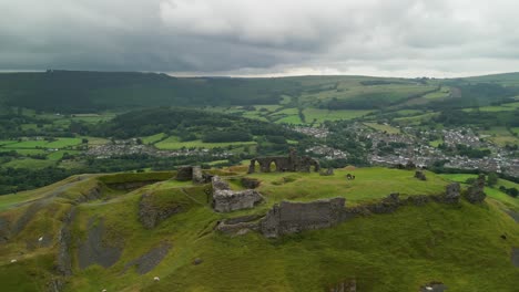 Dinas-Brân-castle,-legendary-home-of-the-Holy-Grail,-Wales---aerial-fast-clockwise-rotate-on-a-moody-summer’s-afternoon