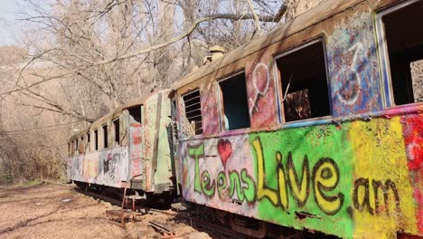 Devastated-rusting-train-cars-with-graffiti,-Children-Railway,-Yerevan,-Armenia