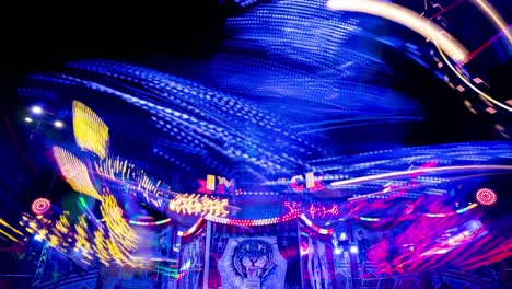 Night-Time-lapse-of-illuminated-Carnival-Ride-at-Fairground,-Motion-Blur