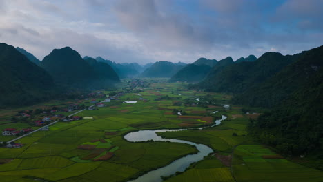 Karst-landscape-and-flat-land-vivid-green-rice-paddies-of-Bac-Son-Valley,-Vietnam