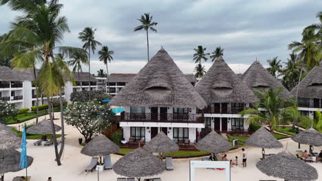 Wooden-Thatched-Roof-Villas-At-The-Resort-Town-Of-Nungwi-Beach-In-Tanzania,-Zanzibar-Island