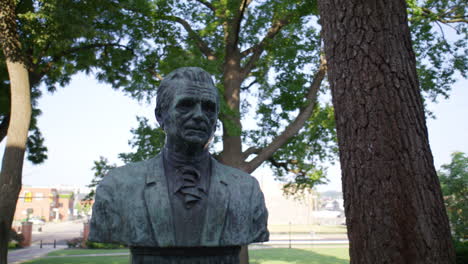 Statue-of-the-founder-of-Marshall-University-in-Huntington,-West-Virginia-with-gimbal-video-moving-up