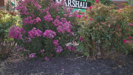 Entrance-sign-to-Marshall-University-in-Huntington,-West-Virginia-with-gimbal-video-moving-up