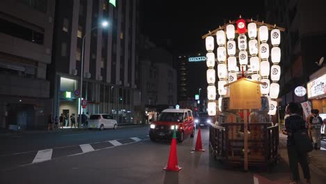 Slow-motion-static-shot-of-Japanese-streets-of-Kyoto-at-night-during-festival