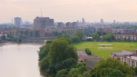 Aerial-view-over-Thames-of-St-Paul's-School-playground-and-Hammersmith-Bridge