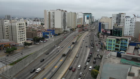 Aerial-View-of-Express-Highway-Traffic-in-Miraflores-Downtown-Neighborhood-of-Lima,-Peru