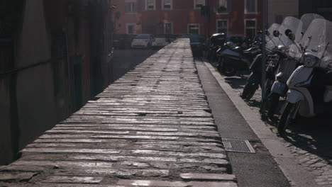 Roman-Brick-wall-surrounding-buildings-and-vespas