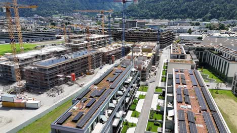 Modern-apartment-buildings-with-solar-panels-on-roof-in-Chur-City,-Switzerland