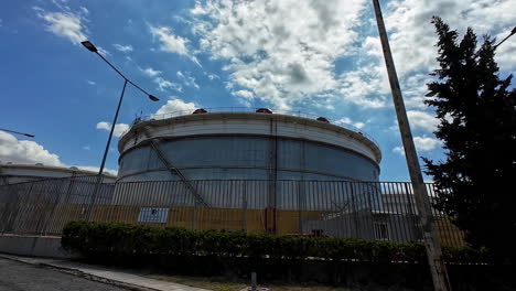 Driving-in-industrial-area-Athens,-Greece,-factory-plants-and-oil-refinery