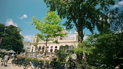 Serene-summer-day-stroll-past-Vondelpark-Pavilion,-historic-landmark-in-Amsterdam