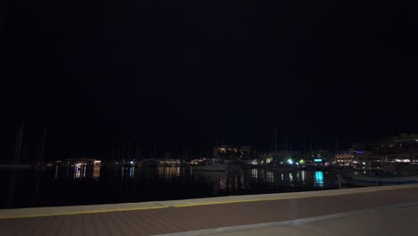 Port-Marina-night-Piraeus-Athens-Greece,-calm-Mediterranean-sea-water-light-reflexion