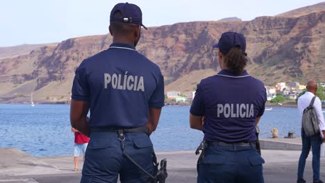 Couple-of-Police-Officers,-Man-and-Woman-on-Tarrafal-Port,-Cape-Verde