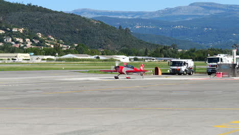 Extra-200-Aerobatic-Airplane-at-Cannes-Airport---Jet-Plane-Takes-Off