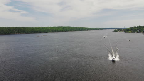 Lateral-Left-aerial-footage-of-motorboats-on-Kennebec-River