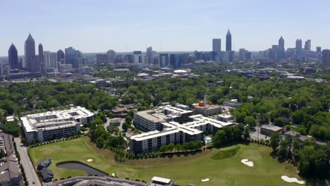 Aerial-of-skyline-views-of-Buckhead,-Midtown-and-Downtown-Atlanta-from-Waterworks-reservoir