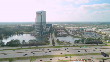 Parallax-establishing-aerial-shot-of-the-city-of-Woodlands-in-Texas-USA