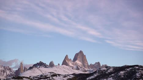 Timelapse-of-mount-Fitz-Roy-and-Cerro-Torre-just-before-sunrise-with-clear-skies-and-serene-landscape-in-Patagonia