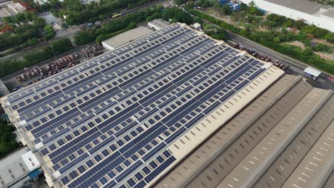 Aerial-shot-of-solar-panels-on-the-top-of-a-factory