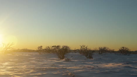 Sunset-glow-over-the-summit-of-a-mountain-in-the-Victorian-high-country-with-snow-on-the-landscape