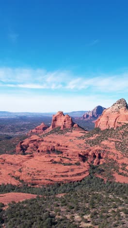 Vertical-Aerial-View-of-Picturesque-Landscape-Around-Sedona,-Arizona-USA,-Red-Rock-Hills-and-Green-Valley