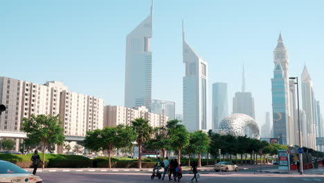 Dubai-skyline,-Sheikh-Zayed-Road-and-the-Emirates-Towers,-handheld-day