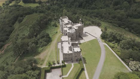 Aerial-fly-in-capturing-the-impressive-Castle-Drogo-in-Devon,-UK,-July-2024