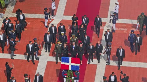 President-Luis-Abinader-and-his-wife,-with-their-entourage,-approach-the-Altar-of-the-Fatherland-to-deliver-the-floral-tribute-in-an-aerial-shot-on-Independence-Day