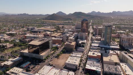 Aerial-Shot-of-Downtown-Tucson-Arizona-in-Daytime,-Arid-Desert-Mountains-in-Background