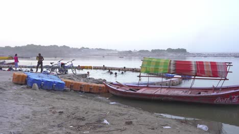 People-bathing-in-holy-river-of-Triveni-Sangam-in-summer-heat-wave