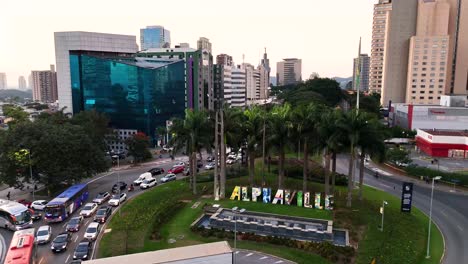 Establishing-shot-of-São-paulo-city-skyline-flying-above-Letreiro-da-Cidade-Roundabout-and-Alameda-Rio-Negro-street