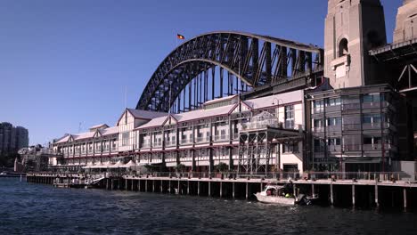 Hand-held-footage-of-wharves-at-Walsh-Bay-with-Sydney-Harbour-Bridge