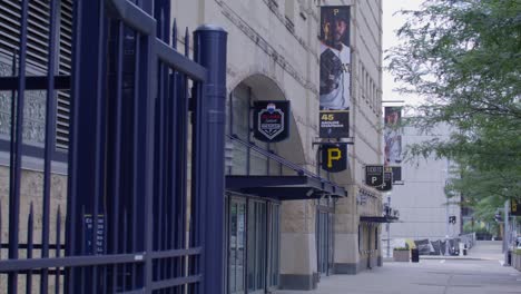 Ticket-sales-booth-and-player-banners-outside-of-PNC-Park,-home-of-the-Pittsburgh-Pirates-in-Pittsburgh,-Pennsylvania-with-gimbal-video-moving-left-to-right