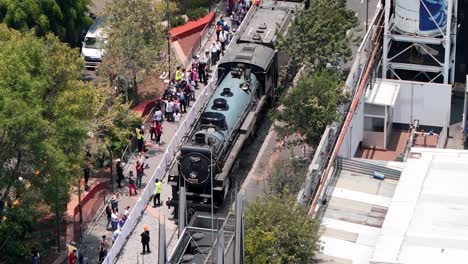 Drone-shot-of-people-waiting-to-see-train-in-Mexico-city